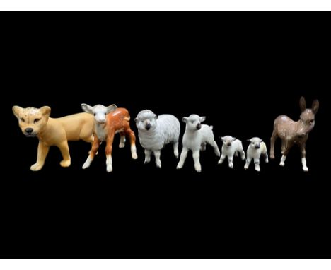 A Collection of Beswick Figures including two sheep and two lamb figures, a donkey figure in brown gloss, a calf and a liones