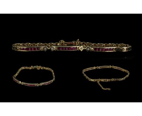 18ct Gold Attractive Good Quality Ruby Set Pendant with Diamond Set Spacers. Marked 750 - 18ct. Excellent Clasp. The Baguette