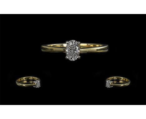 18ct Gold Attractive and Contemporary Single Stone Diamond Set Ring. Full Hallmark for 750 - 18ct. The Oval Shaped Faceted Di