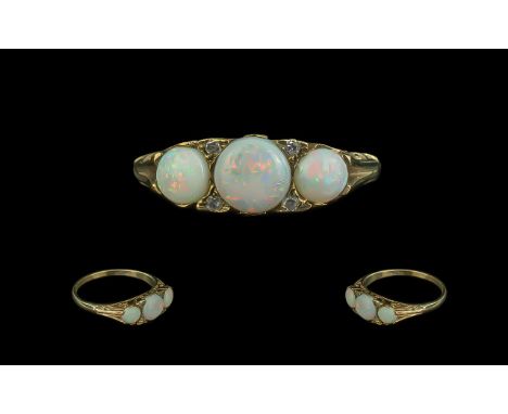 Antique Period Attractive 9ct Gold Three Stone Opal Set Ring, ornate setting, full hallmark to shank.  The Opals of good colo