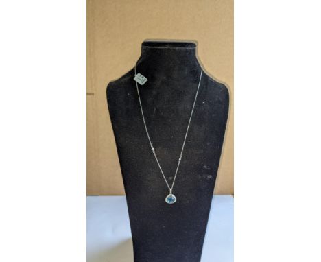 18ct white gold, topaz &amp; diamond pendant with 0.21ct of diamonds. RRP £1,496. This lot includes a white metal chain which