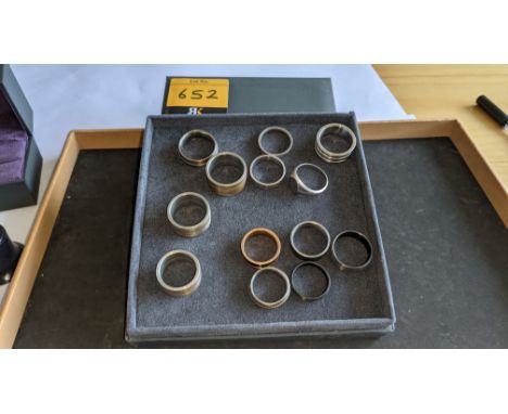 13 assorted men's rings. Understood to be made of a variety of materials including silver, stainless steel, titanium, ceramic