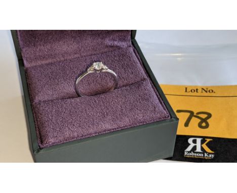 Platinum &amp; diamond ring with a central stone flanked on the shoulders by smaller stones on either side. NB. No price stic