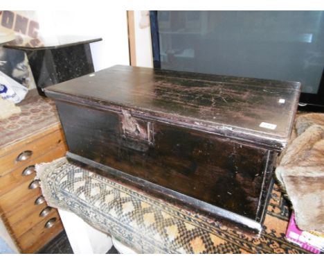 AN ANTIQUE WOODEN TRUNK