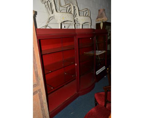 A LARGE PAINTED DISPLAY CABINET, the central bow front section flanked by triple open glass shelves and lighting, width 291cm