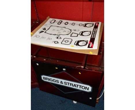 A MODERN BRIGGS &amp; STRATTON WALL MOUNTED SIGN, together with folio of related engine part posters