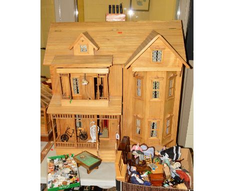 A THREE STOREY WOODEN DOLL'S HOUSE, with fitted interior porch, electrics for lighting, a separate shed and summer house, tog