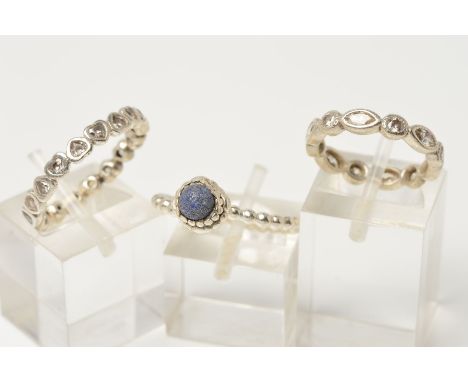 THREE PANDORA RINGS, the first a band ring made of heart shape panels set with colourless cubic zirconias, the second a band 