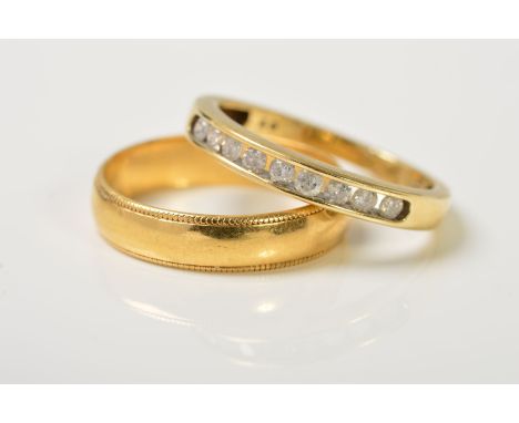 A DIAMOND ETERNITY RING AND AN 18CT GOLD BAND RING, the eternity ring channel set with nine brilliant cut diamonds, total dia