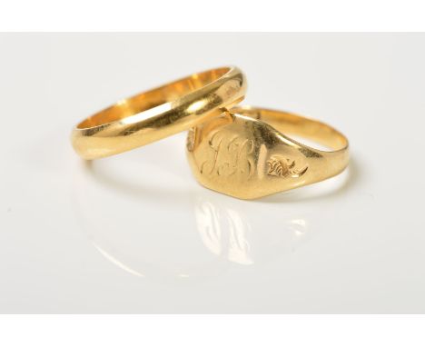A WEDDING BAND AND A SIGNET RING, the wedding band plain D-shape, stamped 18kt, ring size J, the signet ring with engraved in