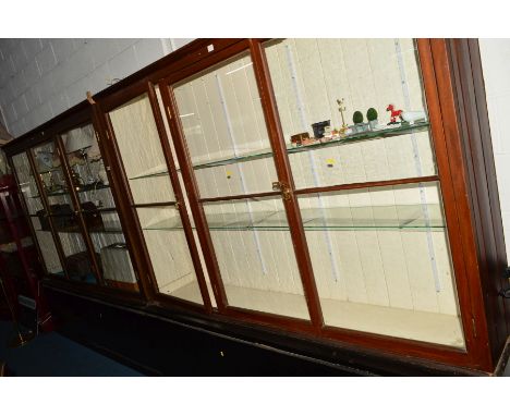 A PAIR OF MAHOGANY THREE DOOR DISPLAY CABINETS, painted interior with double glass shelves and internal lighting on a separat