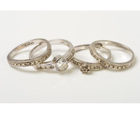 FOUR RINGS, to include a set of three rings, engraved to the inner shank with Today, Tomorrow, Always, two of the rings are s