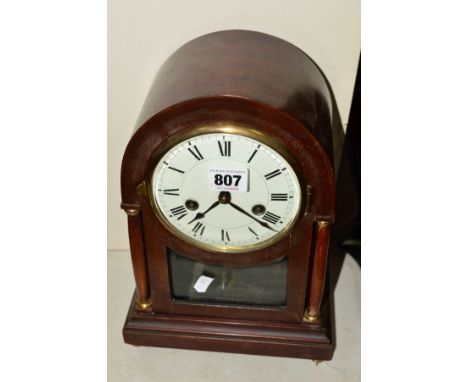 A MAHOGANY CASED BRACKET CLOCK BY GUSTAV BECKER, white porcelain face with Roman numerals, side pillars, brass fittings, arch