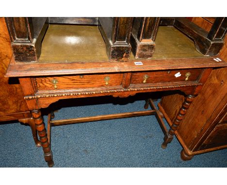 AN EARLY 20TH CENTURY OAK HALL TABLE, with a green tooled leather inlay top, two short drawers on bobbin turned legs, width 9