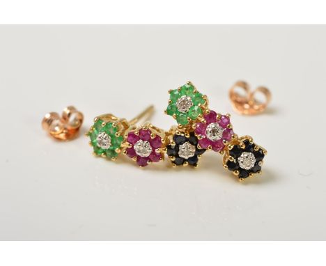 A PAIR OF 9CT GOLD GEM SET EARRINGS, each designed as a vertical line of three flowers, an emerald, ruby and sapphire flower,