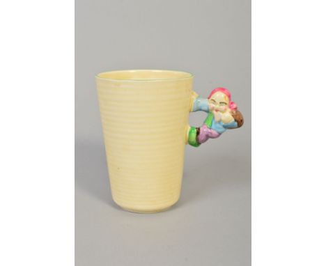 CLARICE CLIFF FOR NEWPORT POTTERY NURSERY WARE MUG, rubbed cylindrical form with an applied figural handle of a gnome, height