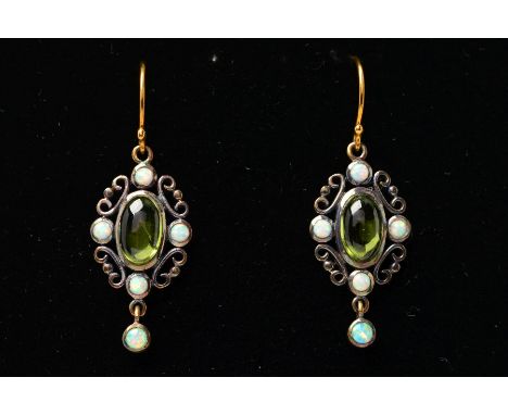 A PAIR OF PERIDOT AND OPAL PENDANT EARRINGS, each designed as a central oval peridot cabochon within a scrolling surround set