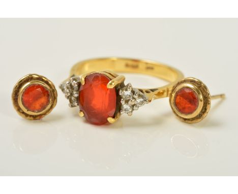 AN 18CT GOLD DIAMOND AND GEM RING AND A PAIR OF GEM EAR STUDS, the ring designed with a central oval orange gem, with a trian