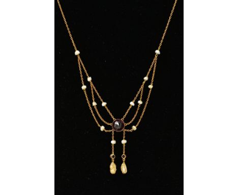 AN EWARDIAN 9CT GOLD AMETHYST AND SEED PEARL NECKLACE, designed as a central circular amethyst suspending two belcher link dr