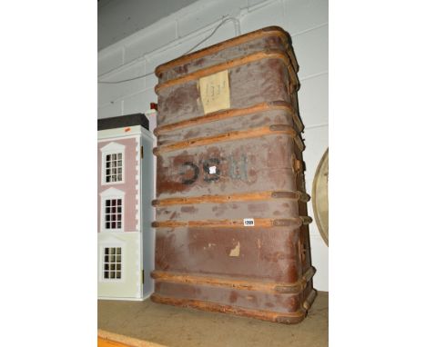 A VINTAGE WOODEN BANDED TRAVELLING TRUNK