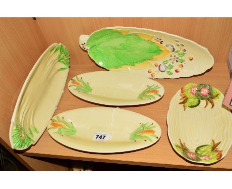 CLARICE CLIFF FOR NEWPORT POTTERY DISHES, to include a pair of corn on the cob dishes, length 25cm (one chipped), a celery di