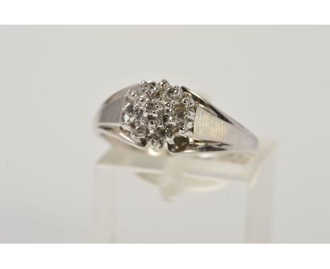 A DIAMOND CLUSTER RING, designed as a tiered cluster of brilliant cut diamonds, to the tapered shoulders, stamped 10k, ring s