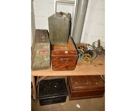 TWO VARIOUS SIZED TIN TRUNKS, another tin trunk, deed box, sewing machine case, two wire metal baskets containing seven nette