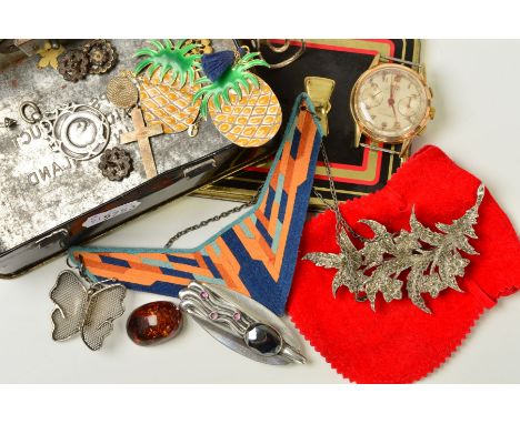 A SELECTION OF MAINLY COSTUME JEWELLERY, to include a geometric felt necklace, a floral marcasite brooch, a silver medal, fou