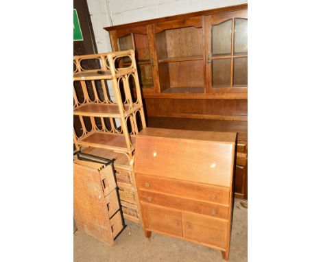 A MODERN OAK DRESSER, an oak fall front bureau, a wicker chest of drawers, coffee table and a similar book shelf (5) (1 key)