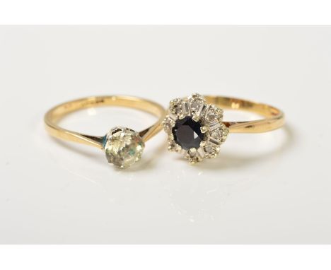 TWO RINGS, the first designed with a single circular colourless paste within an eight claw setting, stamped 9ct and Sil, ring