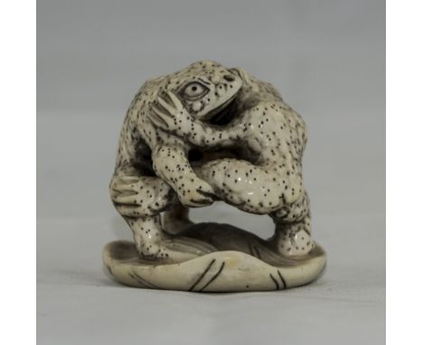 Japanese Ivory Netsuke Finely Carved Depicting 2 Toads Embracing, Raised On A Lily Pad, Signed To Base