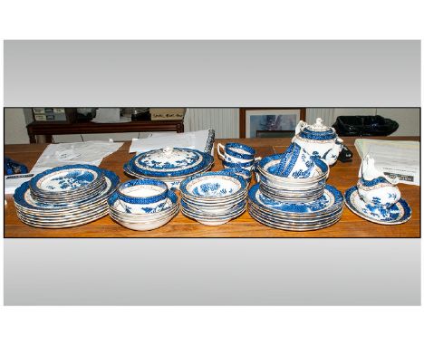 Blue Willow Pattern Dinner Service. Comprises tureens, dinner plates, teapot, gravy boat and tray, bowls etc