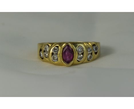 18ct Gold Set Ruby and Diamond Ring, The Central Ruby Flanked by 10 Diamonds, Five to Either Side. Marked 750.