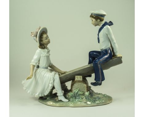 Lladro Figure ' Seesaw ' Model Num 1255. Issued 1974 - 1978. Status Retired. Height 9.5 Inches, 2 Tips of Fingers Missing to 