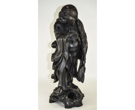 Japanese Fine 19th Century Carved Wooden Figure Of An Immortal, Standing And Holding A Winged Bat Flying In His Right Hand An