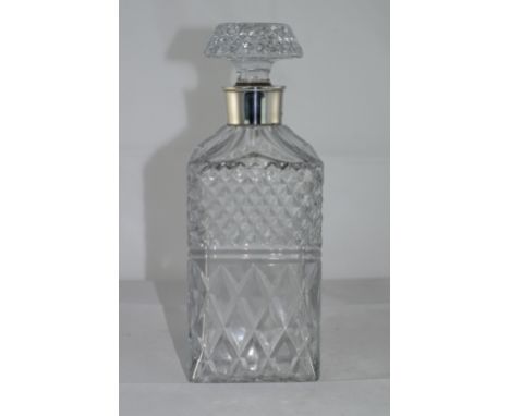 A Fine Quality - Heavy Cut Crystal Decanter with Silver Collar. Hallmark Birmingham 1975. Stands 9.5 Inches High. Excellent C