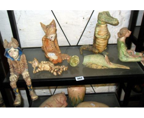 Group of six Amanda Popham Studio pottery figures:- A reclining cat lady, a kneeling cat figure, a budgerigar lidded pot (A/F