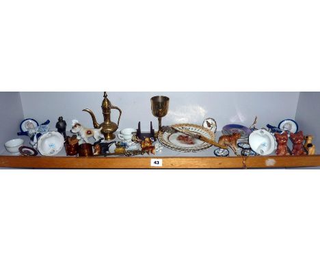 Shelf of assorted small ornaments