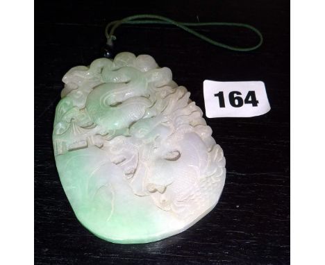 Jade plaque carved with a dragon design to both sides