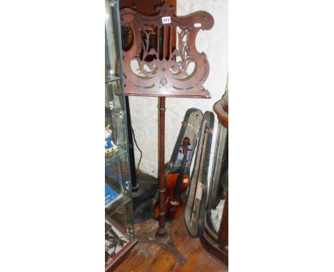 19th c. rosewood music stand with lyre-shaped fretwork top on turned central column and tripod feet