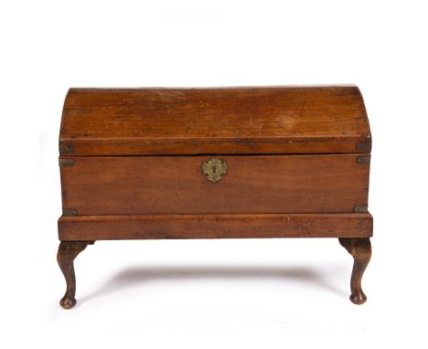 A 19TH CENTURY TEAK DOME TOPPED TRUNK on a later stand, 79cm wide x 46cm deep x 54cm high Condition: split running along the 