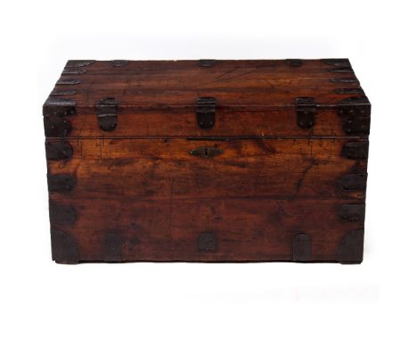 A 19TH CENTURY STAINED PINE AND METAL BOUND TRUNK with a lead lining, bearing a label 'Trunk Department, William Whiteley Lim
