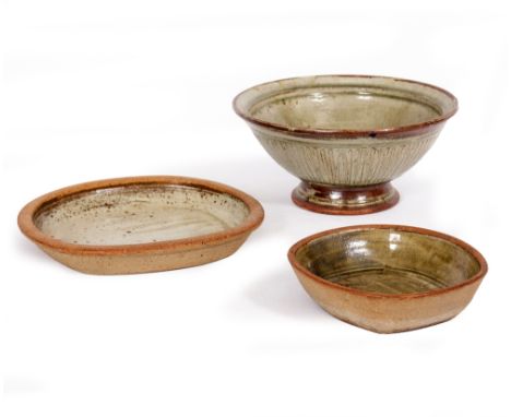 RICHARD BATTERHAM (b.1936) A stoneware bowl with a celadon glaze, 29cm diameter x 13cm high; two shallow bowls in the manner 