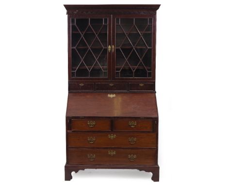 A GEORGE III MAHOGANY BUREAU with an associated Georgian mahogany glazed bookcase top, the top with astragal glazed doors abo