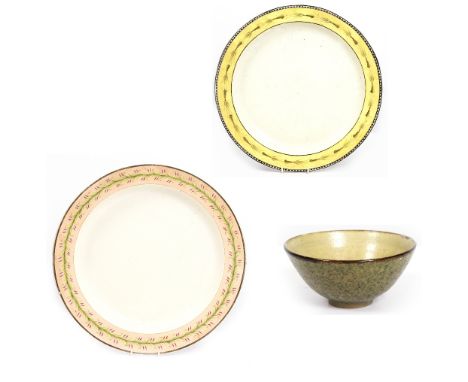 AN EARLY 19TH CENTURY CREAMWARE POTTERY CHARGER with a floral enamel border, 47cm diameter together with a smaller example, 4