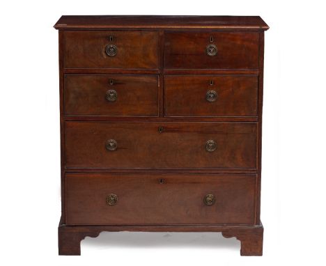 A 19TH CENTURY MAHOGANY CHEST OF FOUR SHORT AND TWO LONG DRAWERS with brass ring handles and raised on bracket feet, 87.5cm w