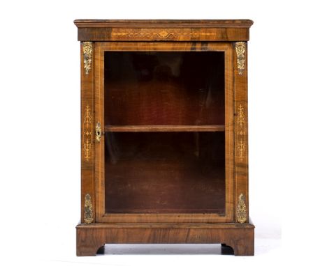 A VICTORIAN WALNUT PIER CABINET with marquetry inlay, gilt mounts and a glazed door enclosing a velvet lined interior, all st