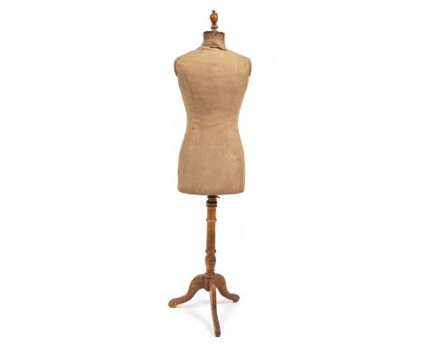 AN EARLY 20TH CENTURY MANNEQUIN ON STAND the mannequin size 42, 164cm in height overall Condition: discolouration to the fabr