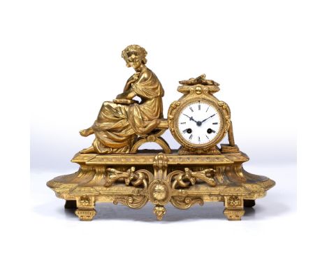 A LATE 19TH CENTURY GILT SPELTER MANTEL CLOCK in the form of a classical maiden seated holding a lyre next to an altar surmou