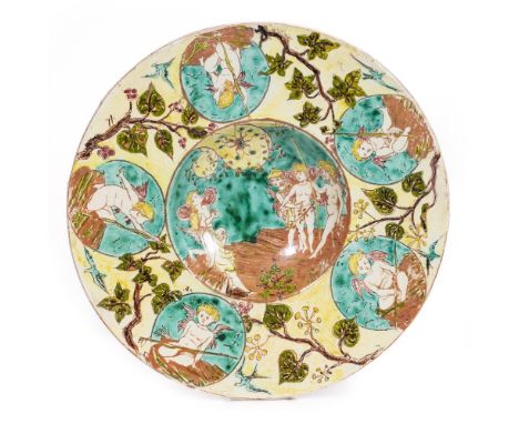 AN ARTS AND CRAFTS STYLE POTTERY BOWLHannah Jones for Della Robbia, with enamelled cherub decoration, 37cm diameter, painters